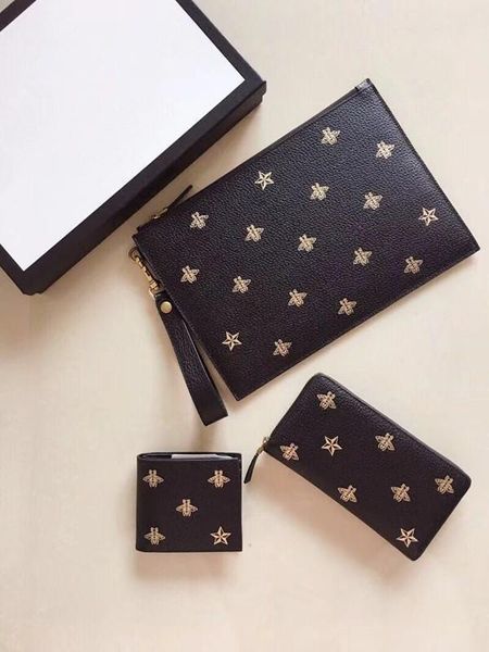 

2018 new handbag. leather zipper clutch. embroidered decoration fashion trend. comes with a detachable leather strap