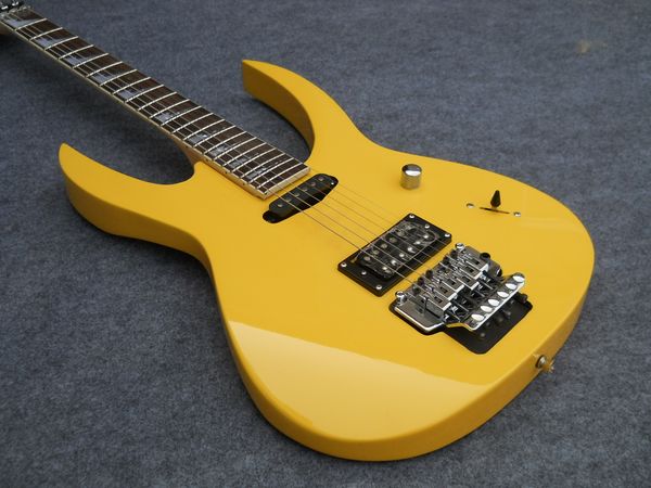 

custom yellow guitar aggressive sharktooth inlay on the fingerboard hs pickups ing