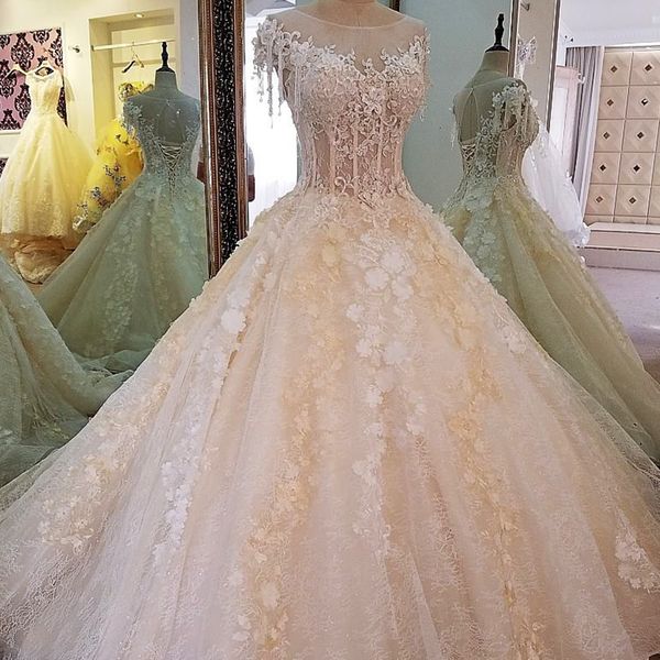 

gorgeous champagne bridal gown with 3d flowers beaded cap short sleeves ball gown lace floor length wedding dress with crystal tassel, White