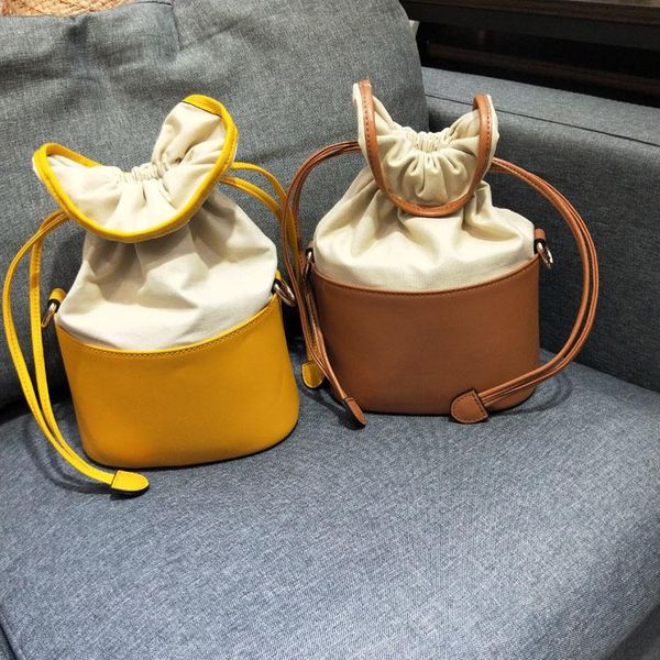 

charm2019 bag niche western style bucket woman package joker ins oblique satchel cowhide canvas wonton