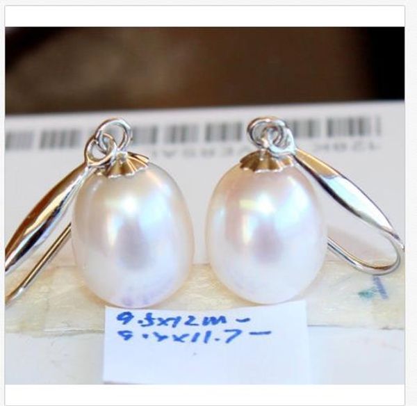 

a pair of natural 13mm australian south seas white pearl earrings 14k white gold, Golden;silver