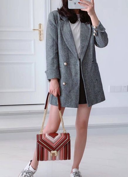 

2019 ladies new handbag american designer shoulder bag star with a high-end custom fashion style colorful leather metal stitching