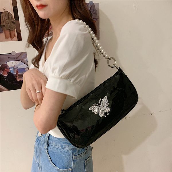 

niche dark design shoulder bag female patent leather butterfly armpit bag used pearl chain oblique carry