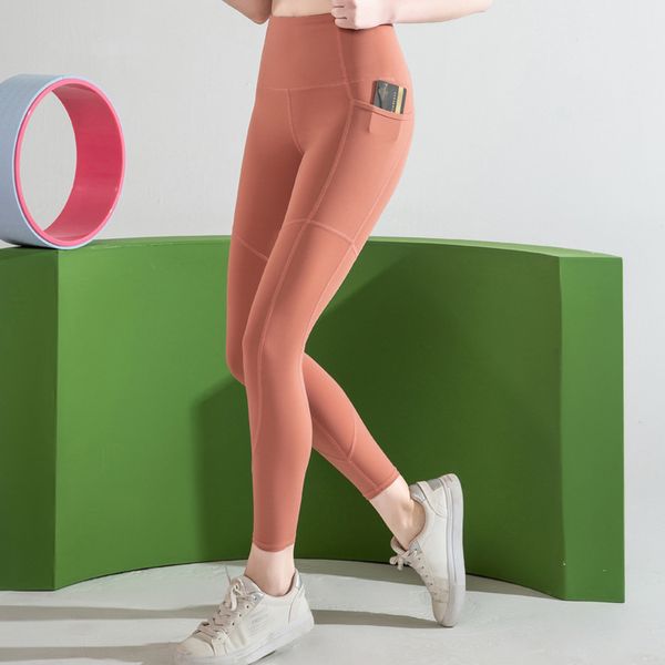 

new solid color bottoming yoga pants female pocket stitching nude sense high elastic running high waist sports tight fitness nine points leg, White;red