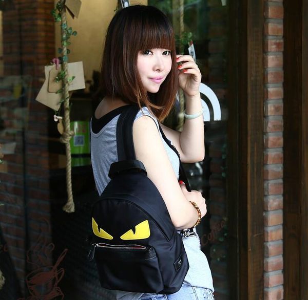 

2020 new canvas character backpack new korean fashion nylon nylon little monster schoolbag teenager istitute wind backpack