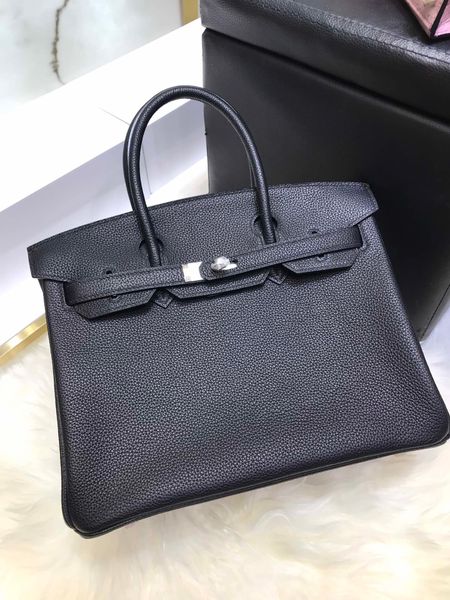 

wholesale original togo skin design handbag,black+purple color,handmade with wax thread,fast delivery by dhl or ems