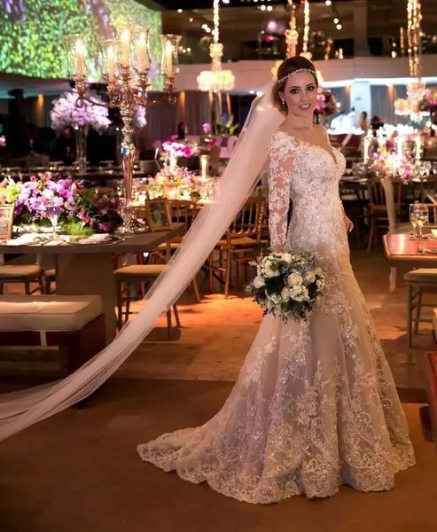 

2020 new luxury mermaid wedding dresses sweetheart lace appliques beads sequins long sleeves illusion button back court train bridal gowns, White