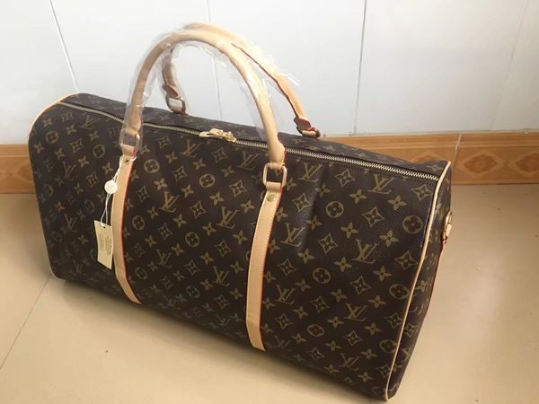 

Men luxury de igner travel luggage bag men tote keepall leather handbag duffle bag ac 2019 brand fa hion luxury de igner bag