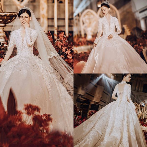 

2020 modest yl ball gown v neck long sleeve hollow lace up wedding dresses lace applique crystal wedding gowns sweep train bridal gowns, White