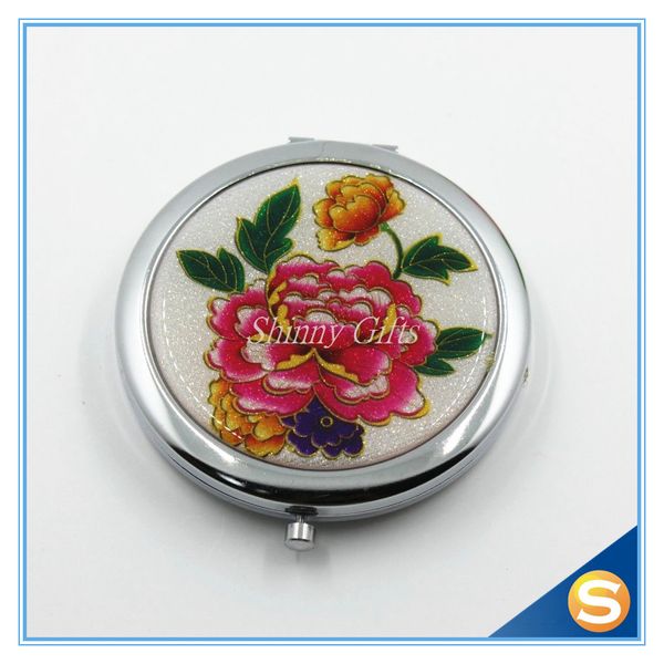 

round compact mirror with colorful flower patterns