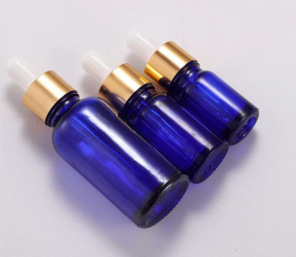 5 ml 10 ml 15 ml 20 ml 30 ml 50 ml 100 ml bottiglie di gocce di vetro blu a bottiglie all'ingrosso di cosmetici di olio essenziale vuoto con coperchio dorato