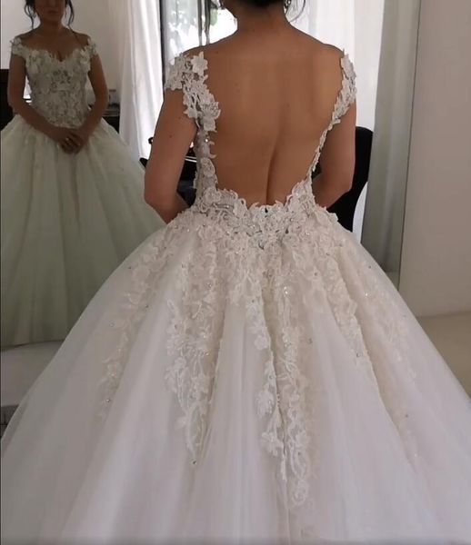 

2020 new arabic a line wedding dresses off shoulder lace appliques flowers pearls beaded sheer open back ball gown formal bridal gowns, White