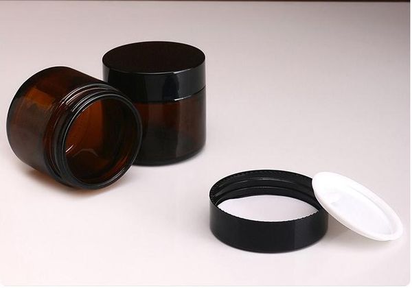 

2 oz amber gla round jar with white inner liner and black lid gla jar prefect for co metic and face cream lotion n2383