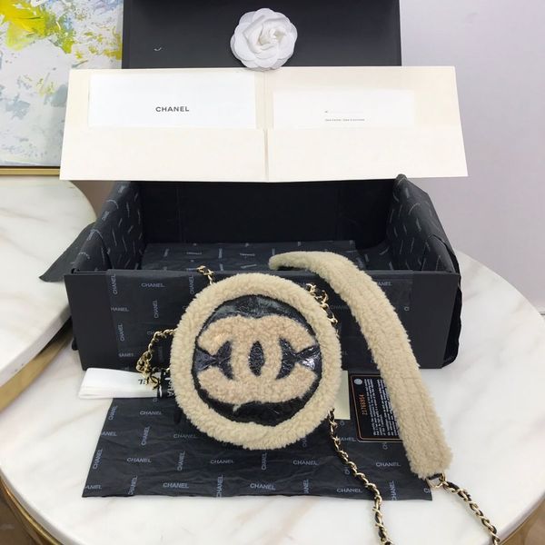 

classic women's small round bag leather very individual burst skin and lamb wool in one touch texture with a long shoulder strap