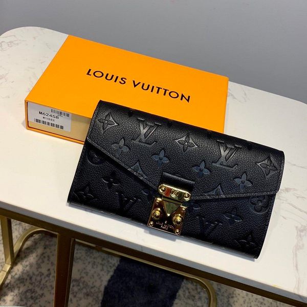 

capucines wallet12 credit card slots adorned with a row of printed monogram flowers surrounded taurillon leather pure color