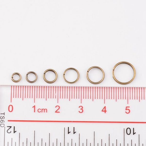 

1 box mixed size antique bronze split iron double jump rings, nickel jump ropes