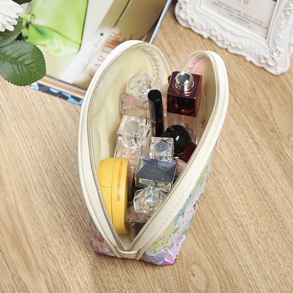 

mini ladies hand-held pu leather shell to hold pu leather makeup bag