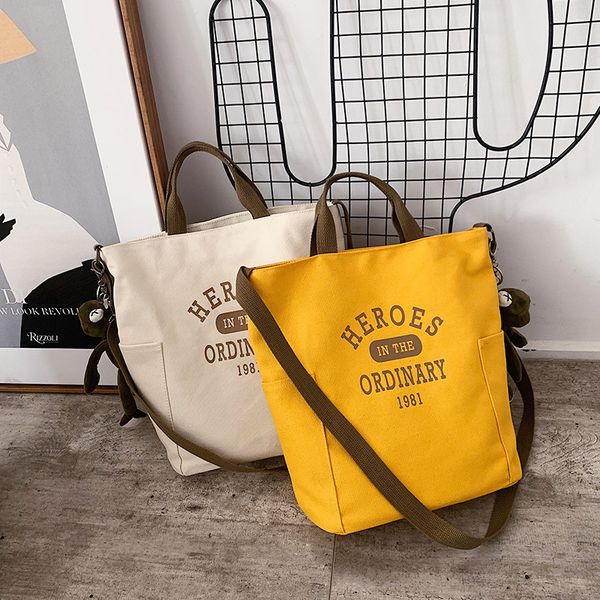 

2019 alphabet shoulder bag solid color canvas bag + pendant new large-capacity portable canvas women