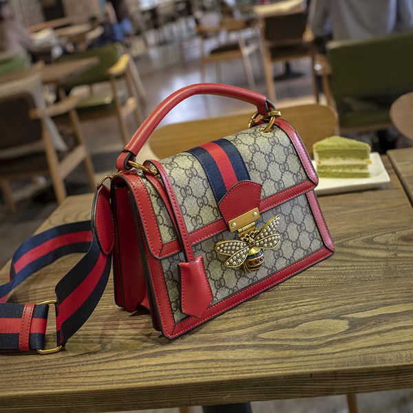 

Real cowhide bag 2019 contra t color letter houlder bag broadband honey bee lock fa hion wild oblique handbag new tyle