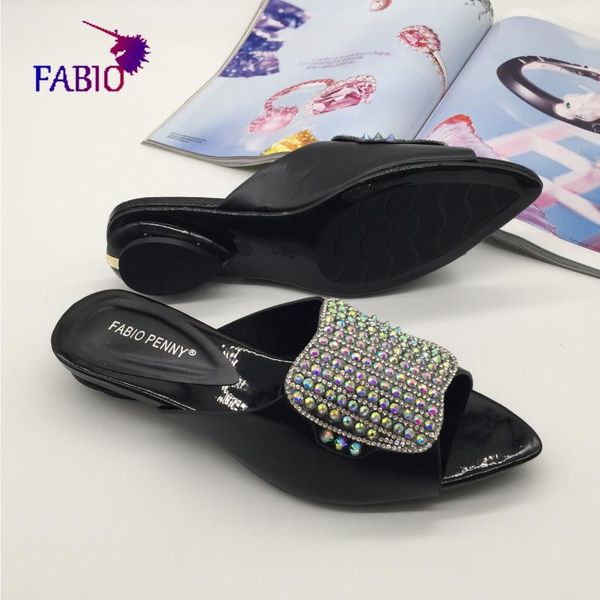 

the african lady wore pointed slippers set with diamonds woman shoes, Black
