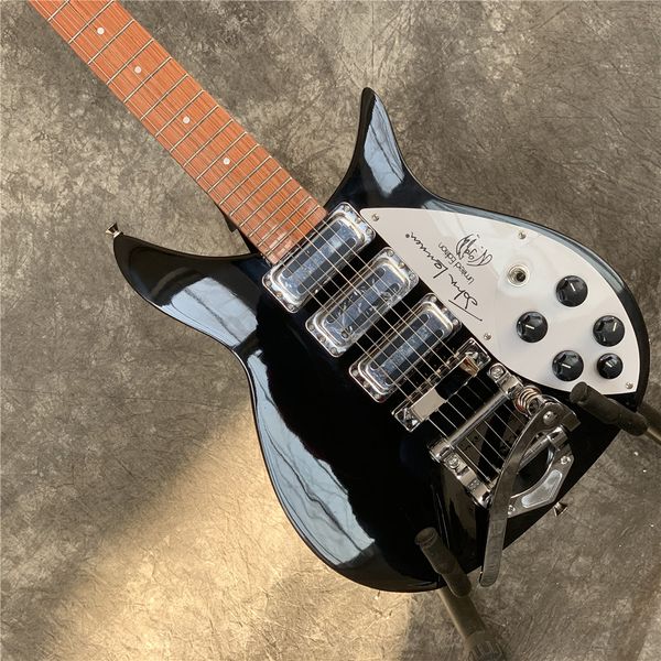 

325 guitar,backer 34 inches,celluloid binding,tremolo tailpiece