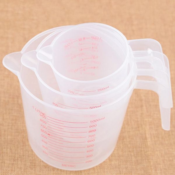 

plastic measuring cup students spoon