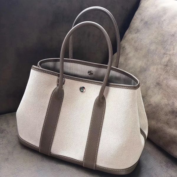 

new garden shoulder canvas high-end canvas with first layer cowhide litchi pattern portable shoulder shopping bag women's bag, White