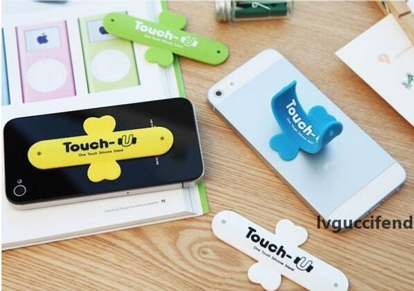 

2017 lovely mini universal mobile phone holder portable one touch silicone desk stand touch-u for smartphone tablet