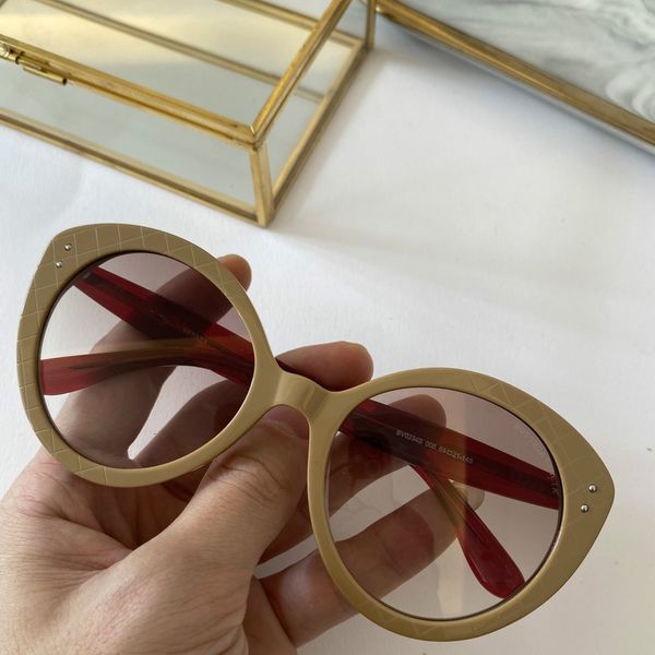

women designer fashion popular sunglasses special edition 0234 sunglasses round cat eye frame uv protection come with package, White;black