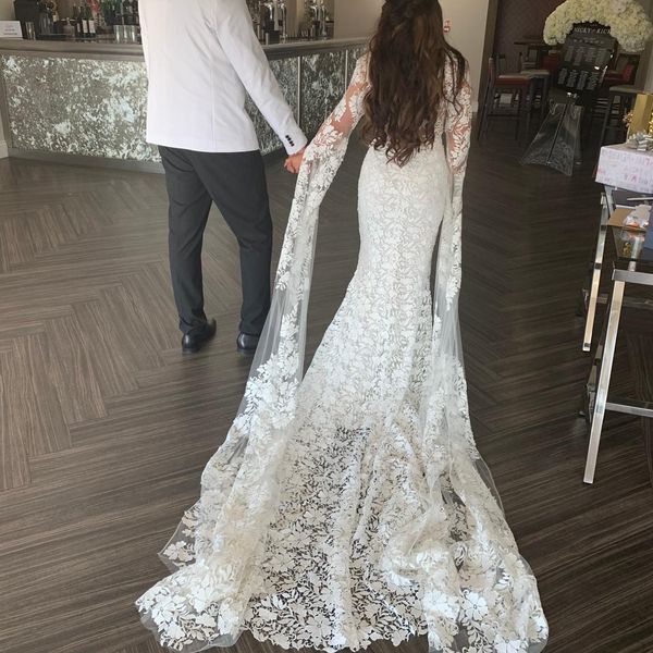 Abito da sposa in pizzo francese 2020 con pura illusione scollo profondo guaina anteriore pizzo trasparente maniche svasate sulla schiena Abiti da sposa treno lungo novia