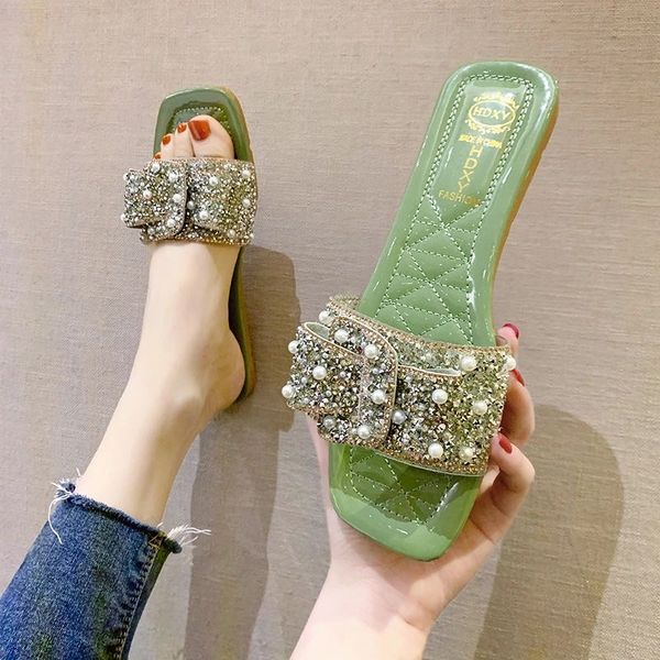 

sandals and slippers female wear 2020 summer new korean version of the pearl bowknot student wild open toe flat slippers women