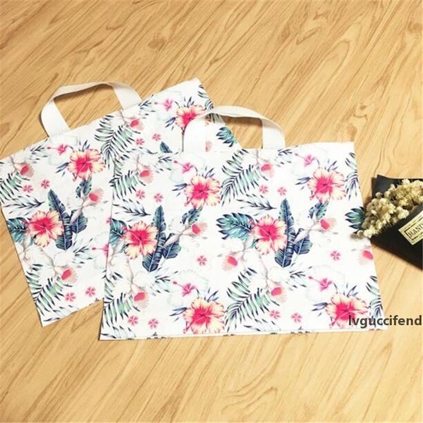 

50pcs/lot plastic gift bags with handles packing bag for wedding party supplies baking package bags shops flowers birthday pouch