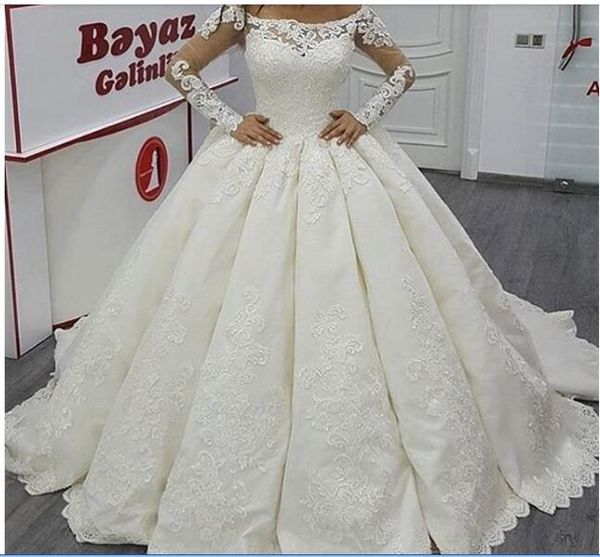 

2020 bateau ball gown wedding dresses illusion long sleeves lace appliqued floor length court train bridal gowns, White
