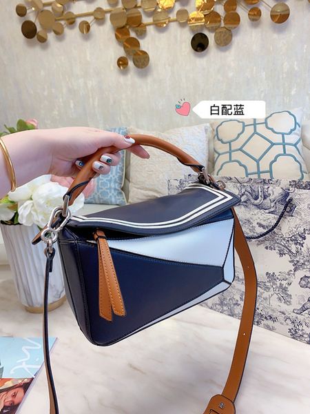 

geometric saddle triangle, single-shoulder cross-body handbag, litchi grain mosaic, cowhide female bag spring and autumn