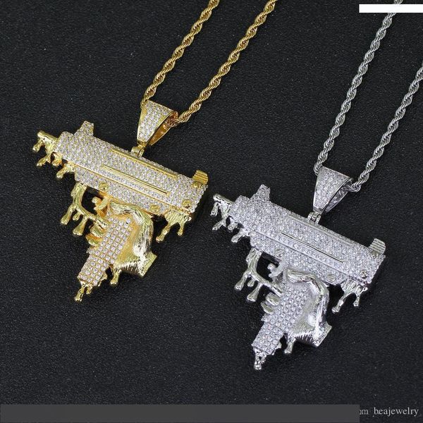 

hand holding dripping gun shape pendant necklace gold color iced out cubic zirconia men hip hop rock jewelry