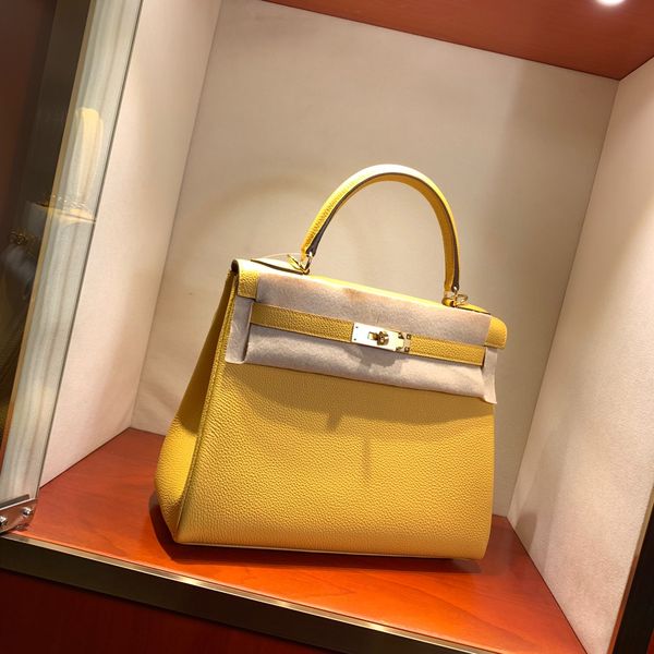 

whosale half handmade 28cm yellow togo leather design purse, wax thread, have both gold and silver hardware,contact me for details