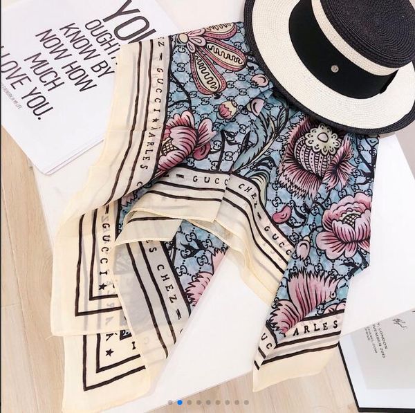 

the latest fashion scarf from 2gg is a square scarf for women only, a 100% twill silk scarf, a black stylish summer look for women, Blue;gray