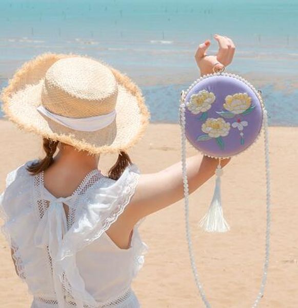 

angelatracy 2020 new arrival luxury purple tassel hanfu fresh floral embroidery metal frame pearl circular bags crossbody bag