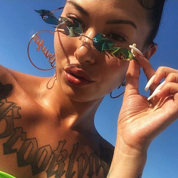 

2020 new lvvkee design women flame shape rimless women sunglasses feminine gafas small frame oculos cat eye mirro, White;black