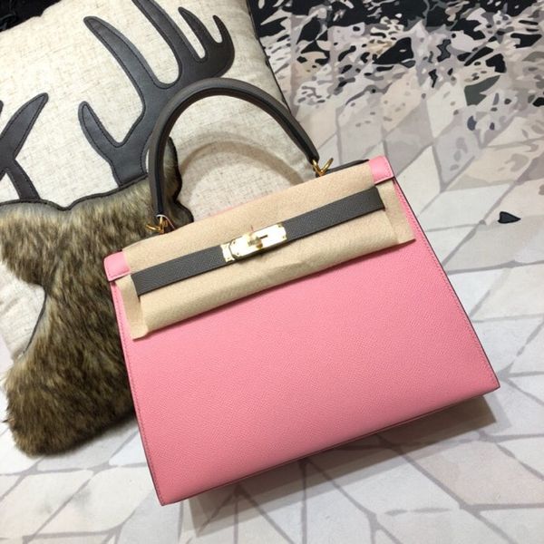 

by order half handmade 2tones 25cm pink epsom design purse, wax thread, have both gold and silver hardware,contact me for details