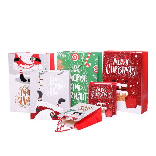 Compras Gift Christmas Gift Paper Bag dos desenhos animados impresso Merry Christmas Bag Jóias Cosmetic Saco do material com alça S M L