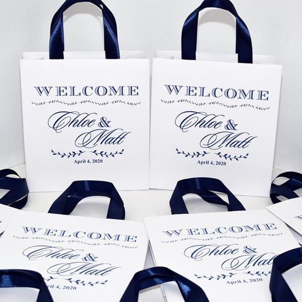

gift wrap personalized wedding welcome bags with navy blue satin ribbon and your names, elegant party favors for weddings guests