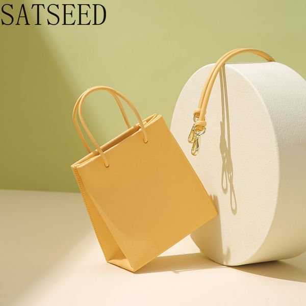 

women's bag leather spring and summer new retro women's single shoulder diagonal bag solid color portable drawstring tote