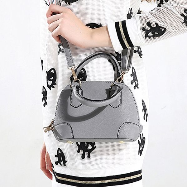 

новый дизайн женщин сумки кожа pu молнии женщины fashiontote сумки shell плеча сумки сотовый телефон карман высокого качества