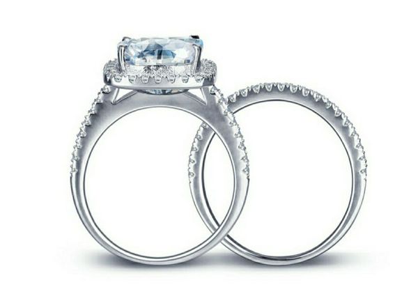 

7*7mm cushion cut moissanite main stone solid 18k white gold halo ring with a matching half eternity band ing