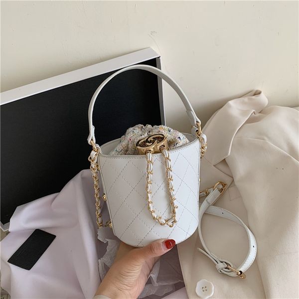

2020 spring new korean style pu women's bag solid color spring new bucket bag rhombic portable crossbody small bucket bjn21