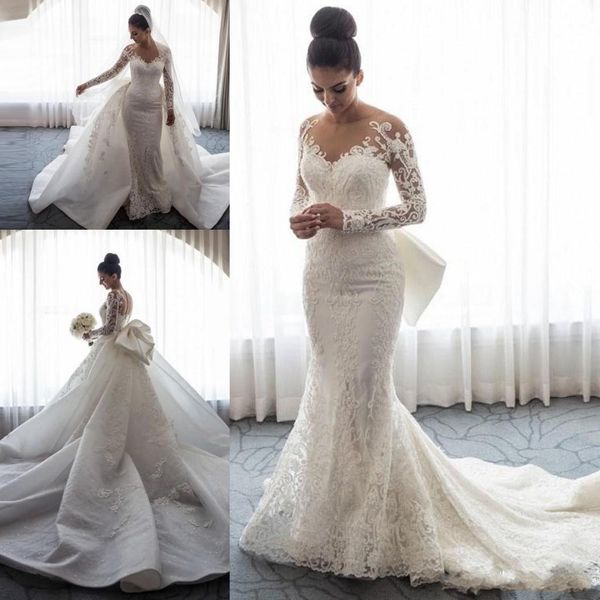 

2018 Luxury Mermaid Wedding Dresses Sheer Neck Long Sleeves Illusion Full Lace Applique Bow Overskirts Button Back Chapel Train Bridal Gowns