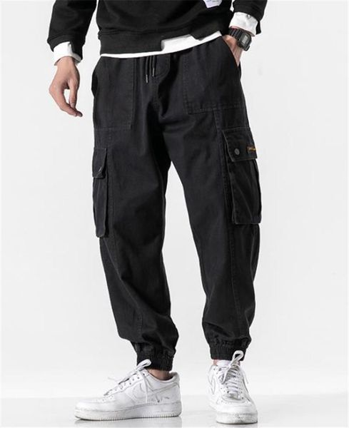 

fashion loose solid color drawstring mens cargo pants casual males clothing big pocket panelled mens designer pants, Black
