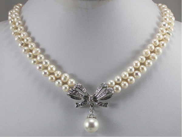 

2 row 7-8mm white/pink/black pearl necklace + inlay crystal bow 18kgp pendant, Silver