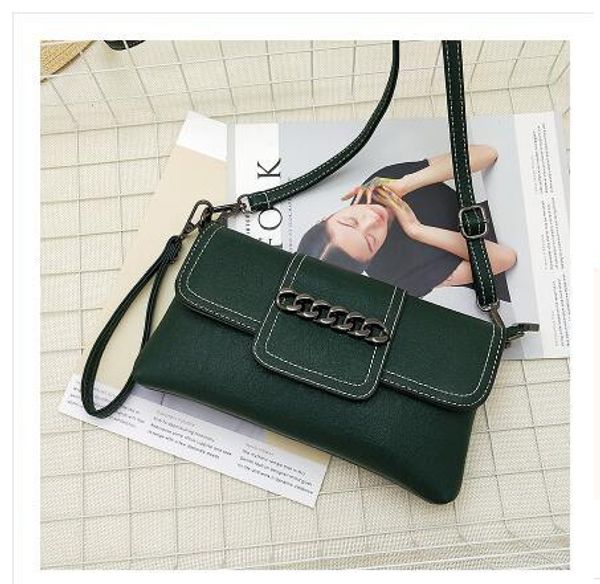 

new- ladies hand shoulder slung mini bag casual wild zipper buckle envelope solid